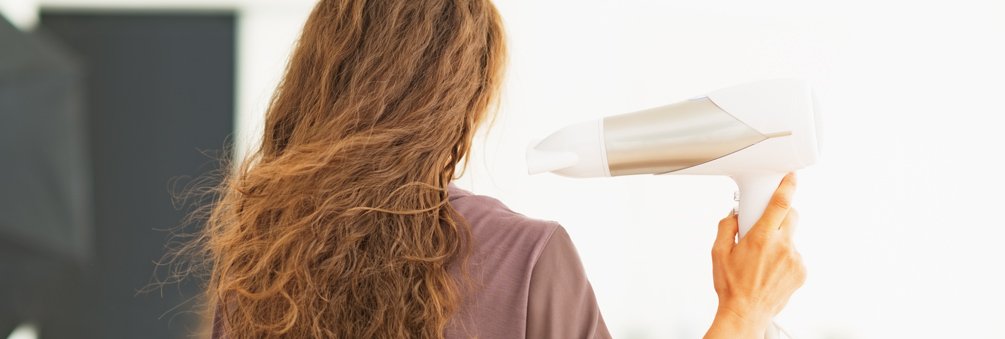 woman blow drying hair quiz